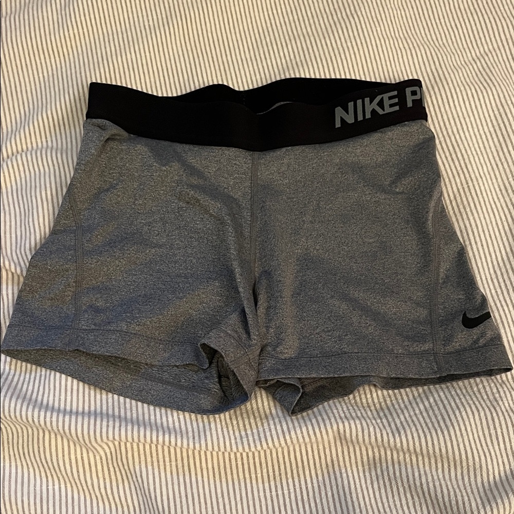 Nike pro shorts gray with black band size small previously owned
